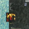 The back cover of a vinyl record album, featuring a tracklist and a blurred image of the band. Náhľad obrázku produktu
