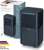 A Beurer air dehumidifier is shown next to its packaging, with a smaller image of the product on the box. Voir les images du produit