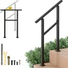 A black metal handrail is shown installed on wooden steps, with greenery in the background. A diagram of the handrail with an angle indicator is also present. Podgląd zdjęcia produktu