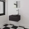 A modern bathroom vanity with a black cabinet, white vessel sink, and chrome faucet, set against a white wall and a black and white checkered floor. Produktbild-Vorschau