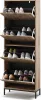 A tall, narrow shoe cabinet with multiple shelves and flip-down drawers, filled with various shoes. Anteprima dell’immagine prodotto