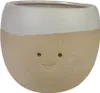 A ceramic pot with a face design. Produktbild-Vorschau