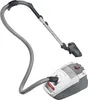 A vacuum cleaner and its hose are shown against a white background. Podgląd zdjęcia produktu