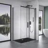 A modern bathroom with a black framed glass shower enclosure, a large window with a forest and lake view, and a white bathtub. Produktbild-Vorschau