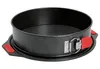 A black springform cake pan with red handles is shown against a white background. Produktbild-Vorschau