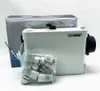 A white SaniPack-WC-Förderanlage sits on a white surface next to its packaging and a bag of accessories. Náhled obrázku produktu