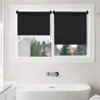 A bathroom with a bathtub and a window covered by black roller blinds. Produktbild-Vorschau