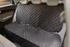 The back seat of a car with a quilted car seat cover. Produktbild-Vorschau