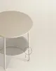A close-up shot of a round side table with a fabric storage basket underneath. Náhled obrázku produktu