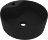A black ceramic sink with a unique, wavy design. Náhled obrázku produktu