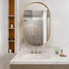 A bathroom vanity with a sink, faucet, and mirror. Voir les images du produit
