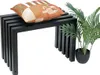 A black metal bench with a decorative pillow and a potted plant. Produktbild-Vorschau