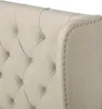 A close-up view of a tufted headboard with nailhead trim. Produktbild-Vorschau