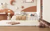 A child's bedroom with a daybed, desk, and shelving unit. Podgląd zdjęcia produktu