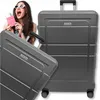 A woman is holding a passport and boarding pass next to a suitcase, with another suitcase in the foreground. Náhled obrázku produktu