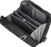 An open black pilot case with multiple compartments and wheels. Produktbild-Vorschau