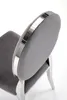Close-up of the back of a gray upholstered chair with a silver trim. Voir les images du produit