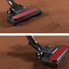 A close-up view of a vacuum cleaner head on a brown carpet. Anteprima dell’immagine prodotto