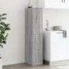 A tall, narrow gray cabinet with two doors stands in a room next to a white countertop with dishes. Anteprima dell’immagine prodotto