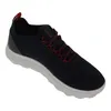 A single blue sneaker with red laces and a white sole, isolated on a white background. Produktbild-Vorschau