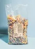 A large clear plastic bag filled with colorful sour gummy worms. Produktbild-Vorschau