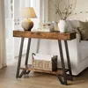 A console table with a lamp, books, and a vase of branches is placed next to a sofa in a living room. Podgląd zdjęcia produktu