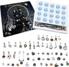 A collection of Tim Burton-themed Halloween charms and a necklace, presented in a box with question mark icons. Produktbild-Vorschau