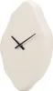 A minimalist, off-white wall clock with an organic, asymmetrical shape and black hands is shown against a white background. Voir les images du produit