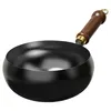 A black wok with a wooden handle on a white background. Produktbild-Vorschau