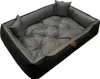 A dog bed with raised sides and two small pillows. Náhled obrázku produktu