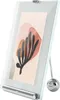 A product shot of a picture frame with a piece of abstract art inside. Produktbild-Vorschau