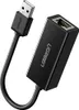 A black USB to Ethernet adapter is shown against a white background. Voir les images du produit