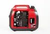 A red and black portable generator with its side panel removed to show the internal components. Produktbild-Vorschau