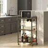 A kitchen scene with a microwave on a serving cart, surrounded by cabinets and a countertop. Produktbild-Vorschau