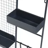 Close-up of black metal wall planters on a grid. Podgląd zdjęcia produktu