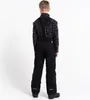 A child is shown from the back wearing black ski pants and a patterned jacket. Produktbild-Vorschau