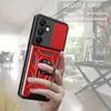 A hand holding a red phone case with a ring holder, with a blurred indoor background. Produktbild-Vorschau