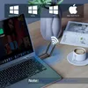 A laptop with a wireless adapter plugged in, on a desk with a coffee cup and a magazine. Produktbild-Vorschau