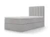 A light gray upholstered box spring bed with a white mattress and topper, shown from a side angle against a white background. Produktbild-Vorschau