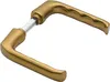 A pair of gold-colored door handles on a white background. Podgląd zdjęcia produktu