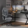 A gaming setup with a chair, desk, and monitors. Produktbild-Vorschau