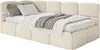 A light beige upholstered bed with a gray blanket and pillows. Náhľad obrázku produktu