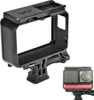 A black protective frame for an action camera is shown against a white background. A smaller inset image shows a camera within a similar frame with a red accent. Produktbild-Vorschau