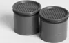 Two cylindrical water filters with perforated tops. Anteprima dell’immagine prodotto