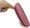 A hand is pressing on a pink silicone saucer. Náhľad obrázku produktu