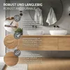 A modern bathroom vanity with two sinks and wooden cabinets, featuring product feature callouts. Produktbild-Vorschau