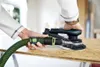 A person is using a Festool Akku-Exzenterschleifer ETSC 2 150 4,0 I-Plus to sand a wooden surface. Voir les images du produit