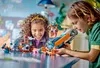 Two children are playing with LEGOs on a table. Anteprima dell’immagine prodotto