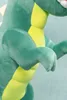 Close-up of a plush dinosaur toy, focusing on its arm and torso. Produktbild-Vorschau