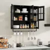 A black wall-mounted cabinet with glass doors, filled with kitchenware and food items, is shown above a kitchen counter with appliances. Produktbild-Vorschau